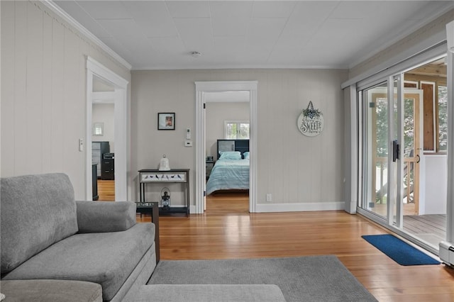 12 Elmore Ave, North Providence, RI 02911 - living area with wood finished floors, crown molding, and a baseboard radiator