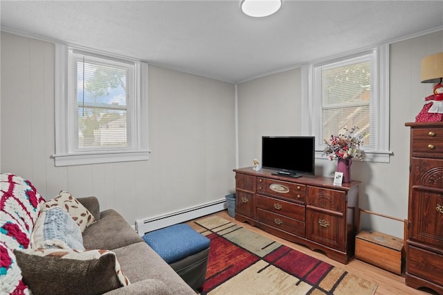 12 Elmore Ave, North Providence, RI 02911 - living room featuring a baseboard heating unit and light wood-style floors