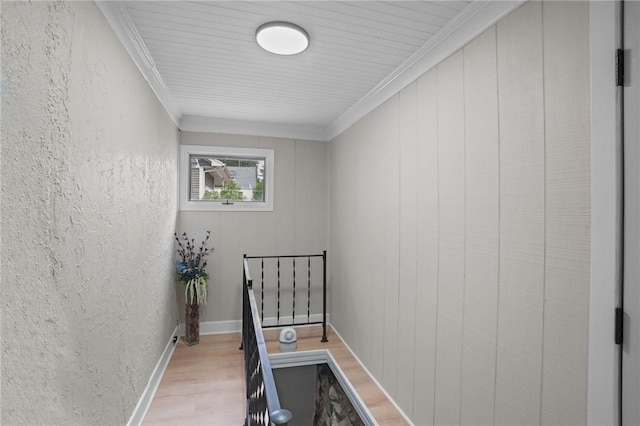 12 Elmore Ave, North Providence, RI 02911 - hallway with light wood-type flooring, ornamental molding, an upstairs landing, and a textured wall