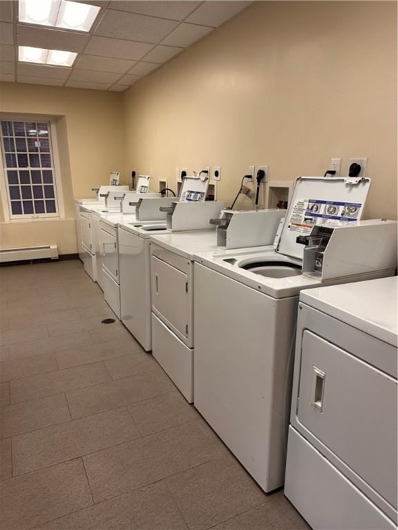 65 Weybosset St Unit 314, Providence, RI 02903 - shared laundry featuring washer and dryer and a baseboard radiator