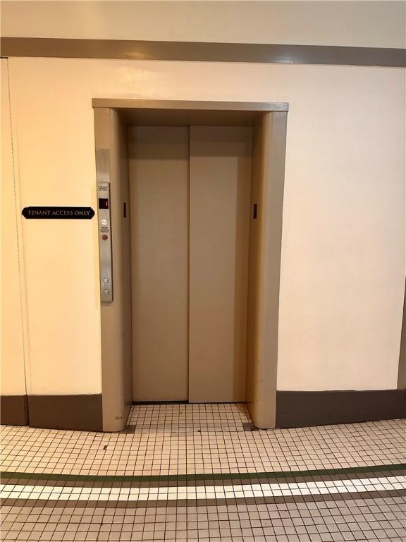 65 Weybosset St Unit 314, Providence, RI 02903 - hallway with elevator and tile patterned flooring
