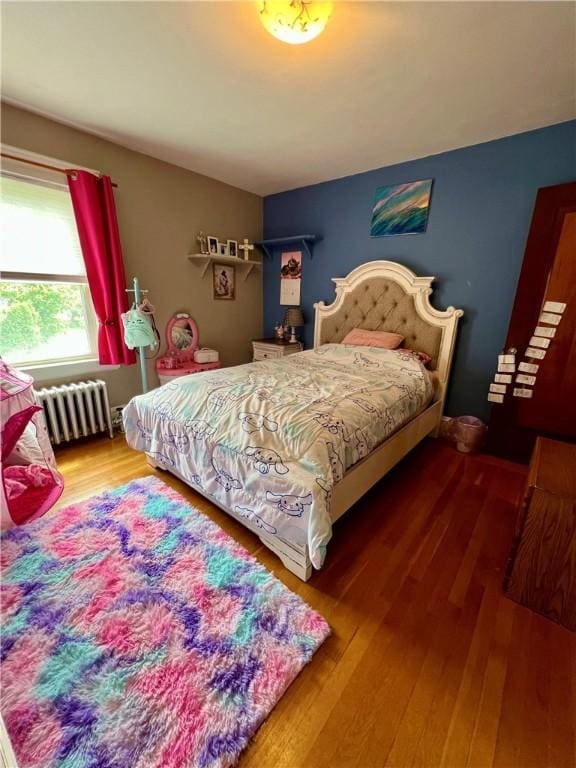 55 Greylock Ave, Cranston, RI 02910 - bedroom with radiator heating unit and wood finished floors