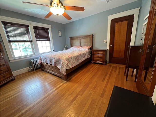 55 Greylock Ave, Cranston, RI 02910 - bedroom featuring radiator, light wood-type flooring, and a ceiling fan
