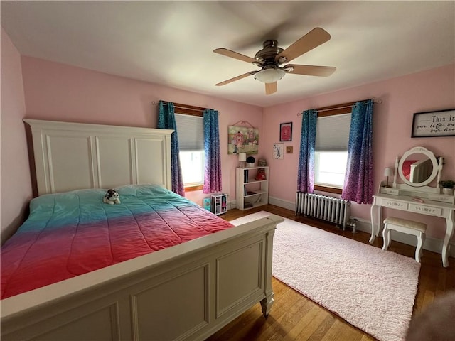 55 Greylock Ave, Cranston, RI 02910 - bedroom with radiator, light wood finished floors, and ceiling fan