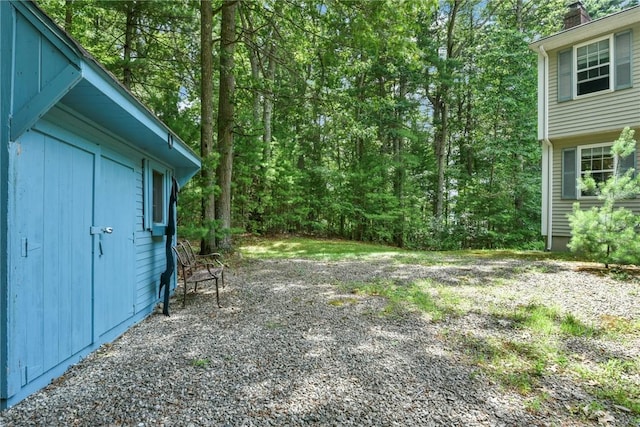 6 Ferris Dr, Coventry, RI 02816 - view of yard featuring a shed and a forest view