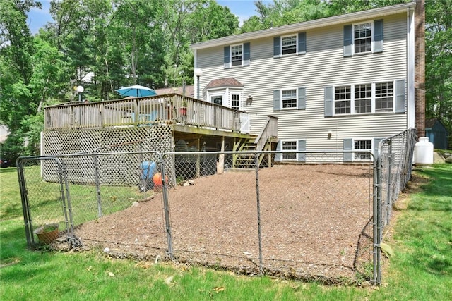 6 Ferris Dr, Coventry, RI 02816 - rear view of house with a wooden deck, stairs, and view of wooded area