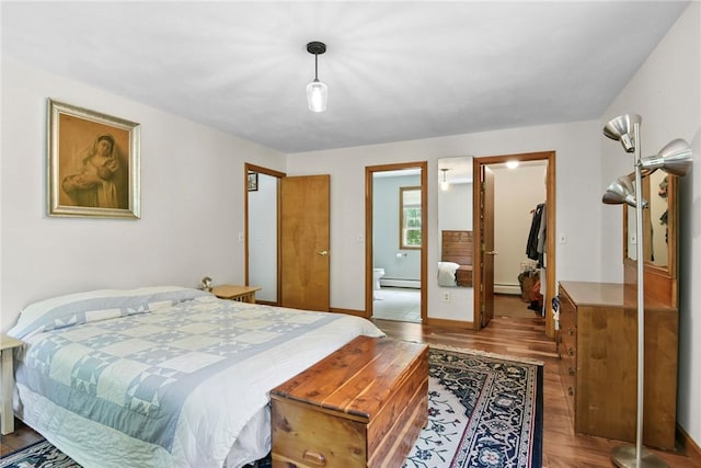 6 Ferris Dr, Coventry, RI 02816 - bedroom with a baseboard radiator, wood finished floors, and a baseboard heating unit