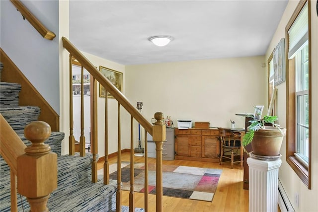 6 Ferris Dr, Coventry, RI 02816 - foyer entrance featuring baseboard heating, healthy amount of natural light, wood finished floors, and stairway