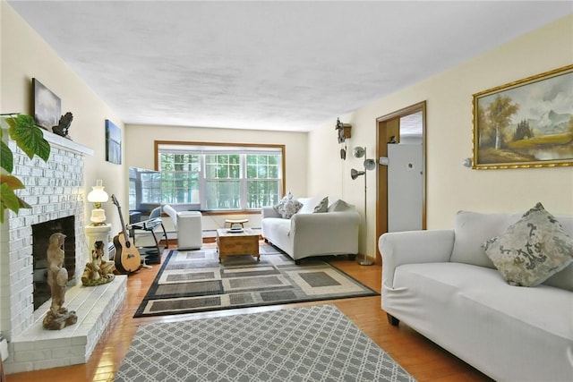 6 Ferris Dr, Coventry, RI 02816 - living area with wood finished floors and a brick fireplace
