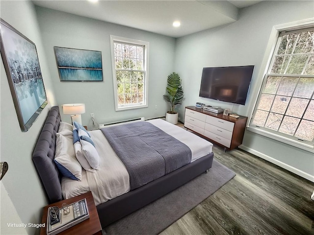 20 Biscuit Hill Rd, Foster, RI 02825 - bedroom featuring wood finished floors, a baseboard radiator, multiple windows, and recessed lighting