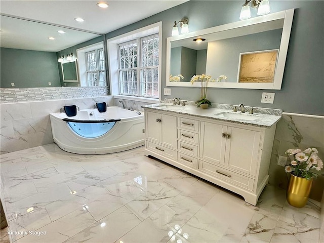 20 Biscuit Hill Rd, Foster, RI 02825 - full bath with marble finish floors, a tub with jets, tile walls, double vanity, and recessed lighting