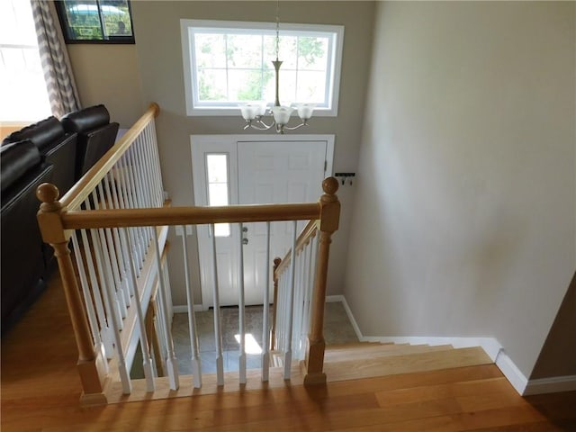 476 Ledge Rd, Coventry, RI 02816 - stairs featuring a chandelier and wood finished floors