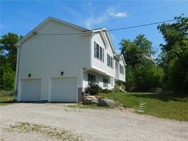 476 Ledge Rd, Coventry, RI 02816 - view of property exterior featuring an attached garage, driveway, and a lawn