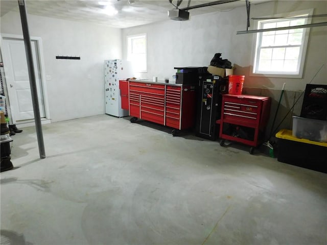 476 Ledge Rd, Coventry, RI 02816 - garage featuring a workshop area and a garage door opener
