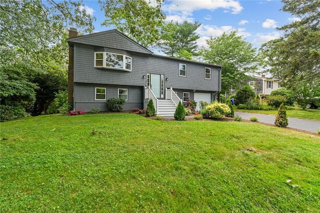 7 Antony Ave, Bristol, RI 02809 - view of front of property featuring a chimney, an attached garage, a front yard, and concrete driveway
