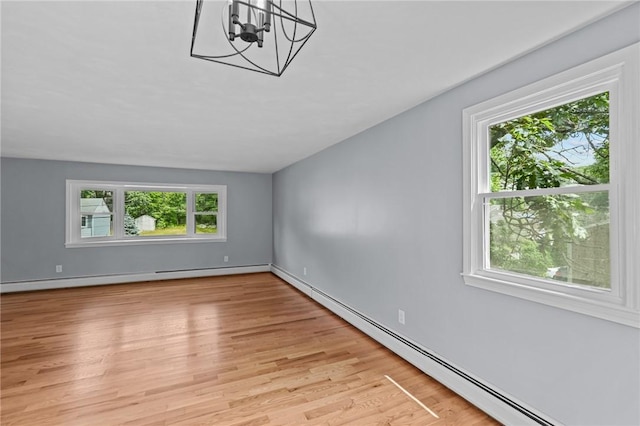 7 Antony Ave, Bristol, RI 02809 - unfurnished room featuring a baseboard heating unit, light wood finished floors, and a chandelier