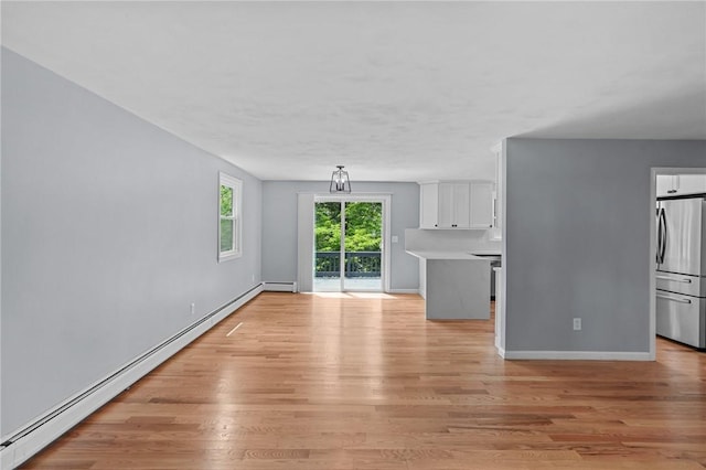 7 Antony Ave, Bristol, RI 02809 - unfurnished living room featuring a baseboard radiator and light wood-type flooring