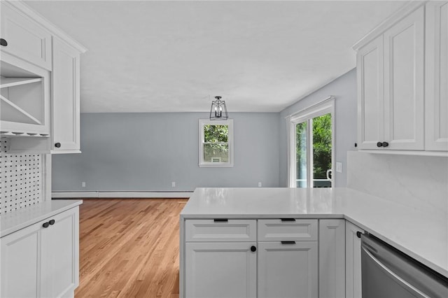 7 Antony Ave, Bristol, RI 02809 - kitchen featuring dishwasher, a peninsula, light countertops, and white cabinetry