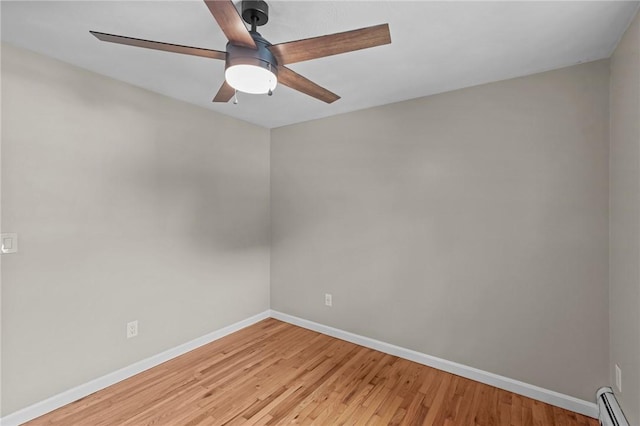7 Antony Ave, Bristol, RI 02809 - empty room with baseboard heating, a ceiling fan, and wood finished floors