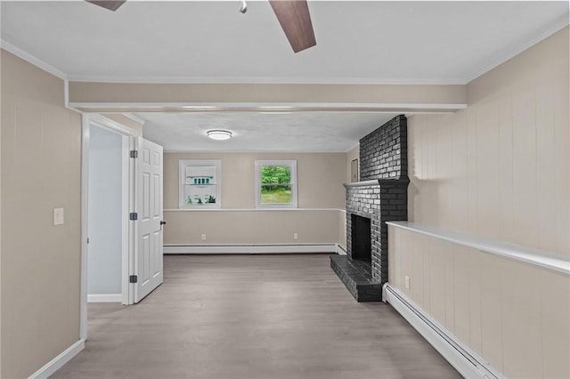 7 Antony Ave, Bristol, RI 02809 - unfurnished living room with a baseboard radiator, a baseboard heating unit, wood finished floors, a brick fireplace, and beamed ceiling