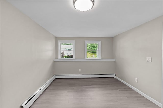 7 Antony Ave, Bristol, RI 02809 - empty room with a baseboard heating unit and wood finished floors