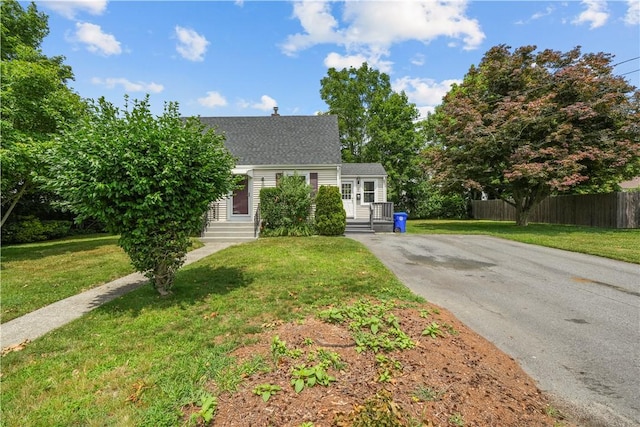 14 Gladding St, Bristol, RI 02809 - view of front facade featuring asphalt driveway and a shingled roof