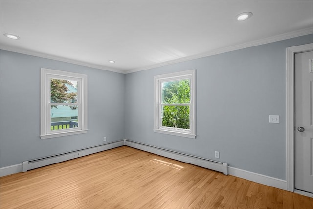 14 Gladding St, Bristol, RI 02809 - empty room with healthy amount of natural light, a baseboard heating unit, ornamental molding, wood finished floors, and recessed lighting