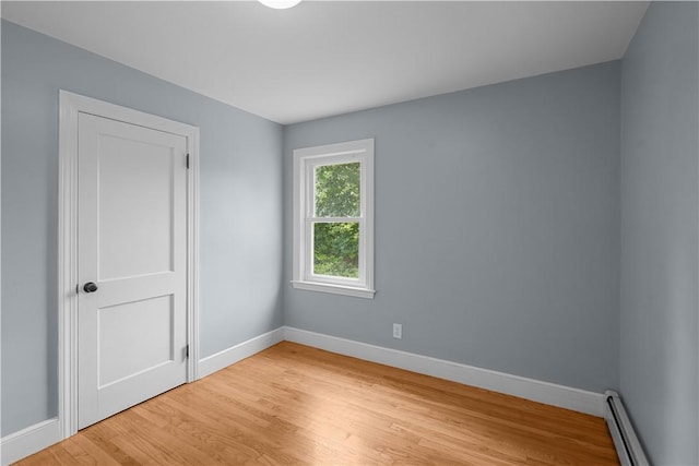 14 Gladding St, Bristol, RI 02809 - unfurnished room featuring a baseboard radiator and light wood-style floors