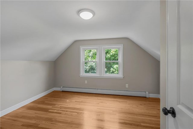 14 Gladding St, Bristol, RI 02809 - bonus room with a baseboard radiator, light wood-type flooring, and lofted ceiling
