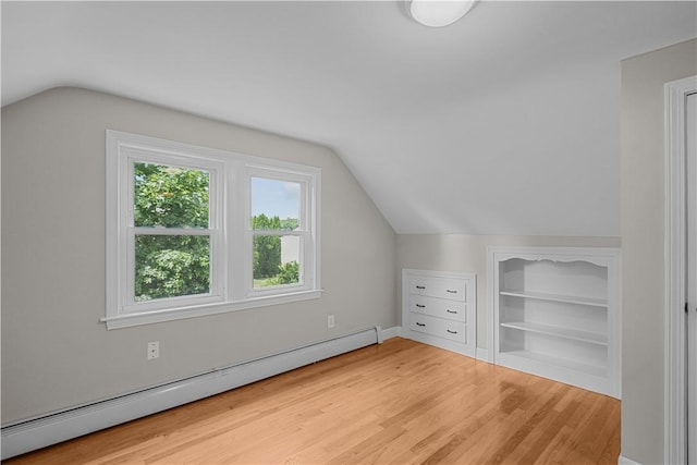 14 Gladding St, Bristol, RI 02809 - bonus room featuring baseboard heating, vaulted ceiling, light wood-type flooring, and built in shelves