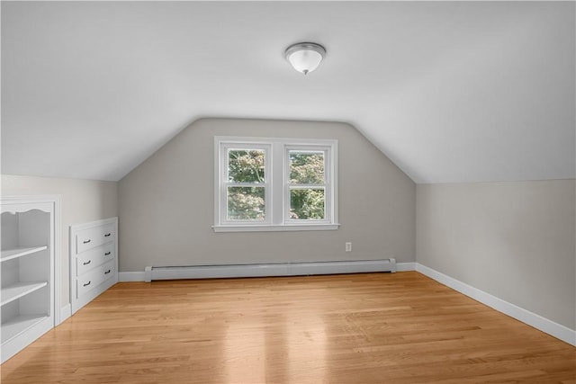 14 Gladding St, Bristol, RI 02809 - additional living space featuring a baseboard radiator, light wood-style floors, and lofted ceiling