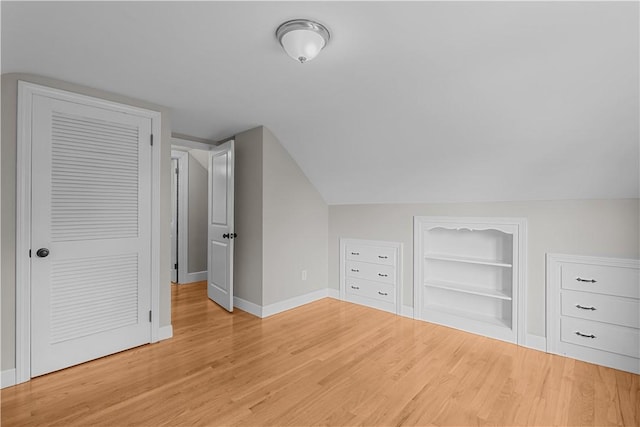 14 Gladding St, Bristol, RI 02809 - bonus room featuring built in shelves, light wood-style floors, and lofted ceiling
