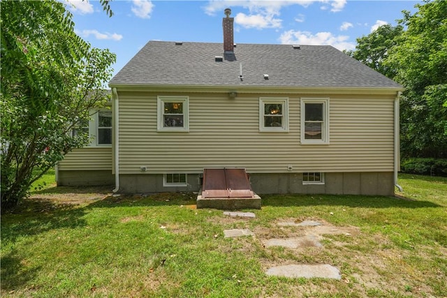 14 Gladding St, Bristol, RI 02809 - rear view of house with a lawn and roof with shingles