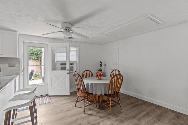 190 White Ave, Warwick, RI 02889 - dining space with attic access, light wood-style flooring, a ceiling fan, and electric panel