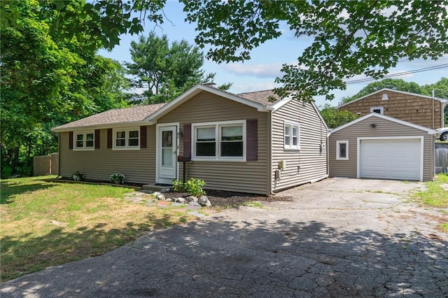 190 White Ave, Warwick, RI 02889 - view of front of property featuring a garage, an outbuilding, and asphalt driveway