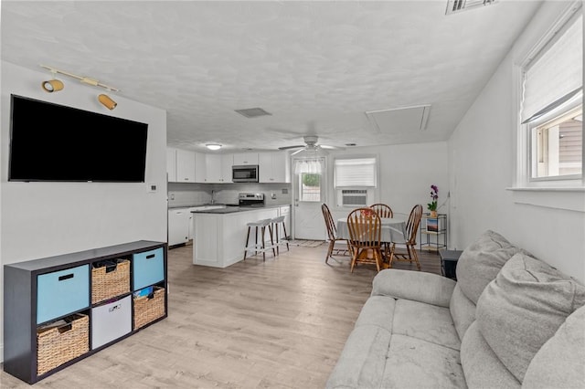 190 White Ave, Warwick, RI 02889 - living room with a ceiling fan and light wood-style flooring
