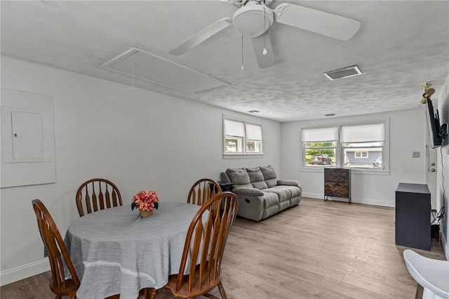 190 White Ave, Warwick, RI 02889 - dining room featuring attic access, light wood finished floors, a ceiling fan, and electric panel