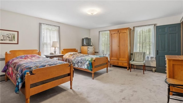 12 Lampercock Ln, Lincoln, RI 02865 - bedroom featuring light colored carpet and a baseboard radiator