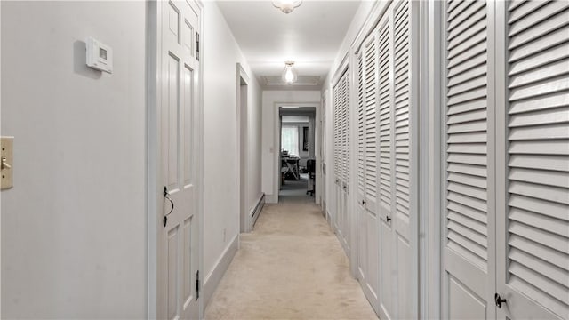 12 Lampercock Ln, Lincoln, RI 02865 - hallway featuring light colored carpet and a baseboard radiator