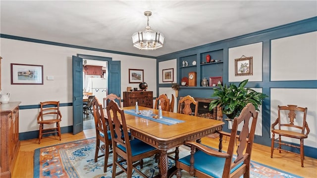 12 Lampercock Ln, Lincoln, RI 02865 - dining room featuring a chandelier, crown molding, and light wood finished floors