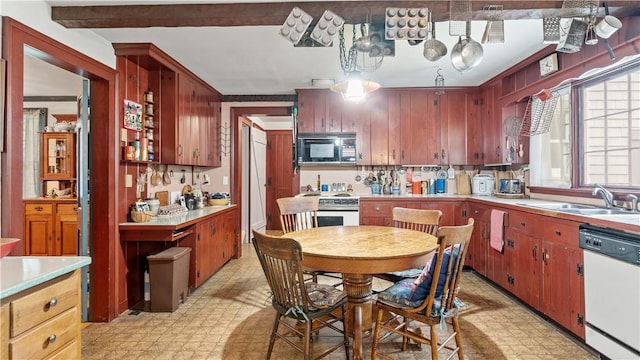 12 Lampercock Ln, Lincoln, RI 02865 - kitchen featuring black microwave, white dishwasher, light flooring, light countertops, and high end stove