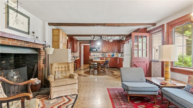 12 Lampercock Ln, Lincoln, RI 02865 - living room with a brick fireplace, beamed ceiling, and light flooring