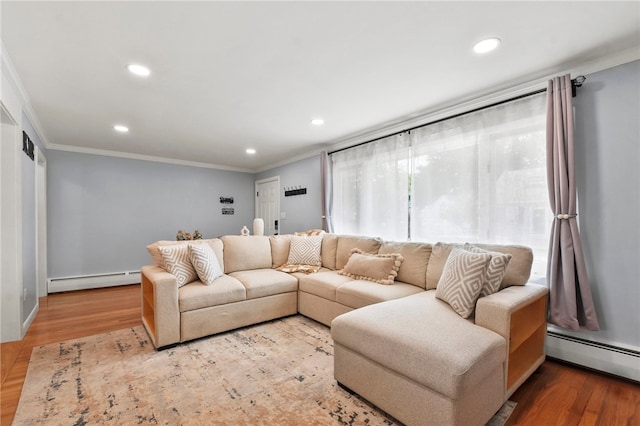 62 Bristol Ave, Pawtucket, RI 02861 - living room featuring a baseboard radiator, crown molding, recessed lighting, and wood finished floors