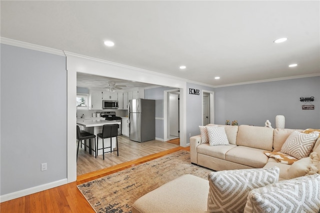 62 Bristol Ave, Pawtucket, RI 02861 - living area featuring crown molding, light wood finished floors, recessed lighting, and a ceiling fan