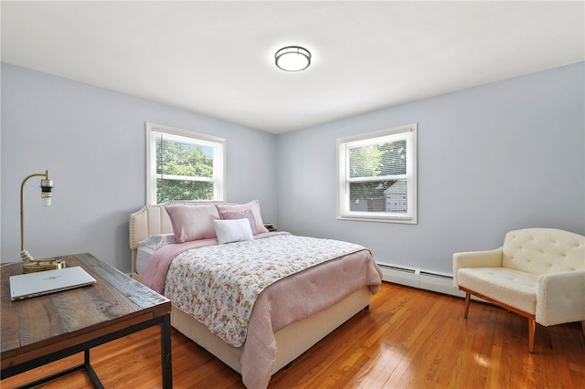 62 Bristol Ave, Pawtucket, RI 02861 - bedroom with a baseboard heating unit and light wood finished floors