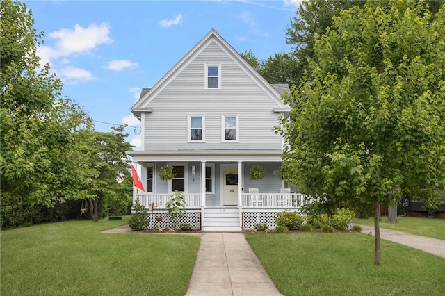 157 Arnold Ave, Cranston, RI 02905 - view of front facade with a porch and a front lawn