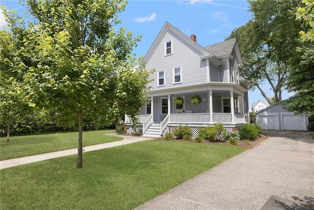 157 Arnold Ave, Cranston, RI 02905 - view of front facade featuring a porch, a detached garage, an outbuilding, a chimney, and a front yard