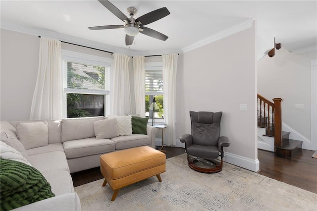 157 Arnold Ave, Cranston, RI 02905 - living area with wood finished floors, ornamental molding, ceiling fan, and stairs