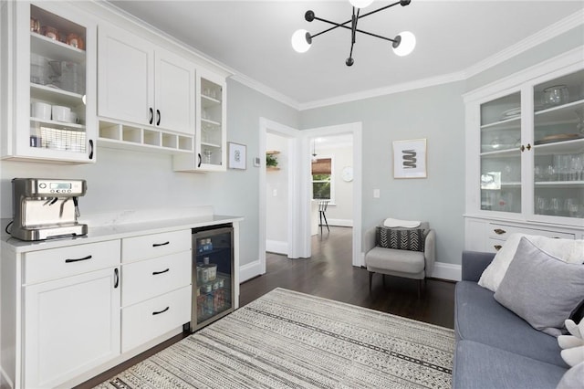 157 Arnold Ave, Cranston, RI 02905 - bar area with wine cooler, dark wood-style floors, a chandelier, and crown molding