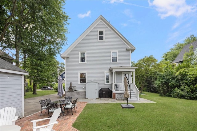 157 Arnold Ave, Cranston, RI 02905 - rear view of property with a patio and a lawn
